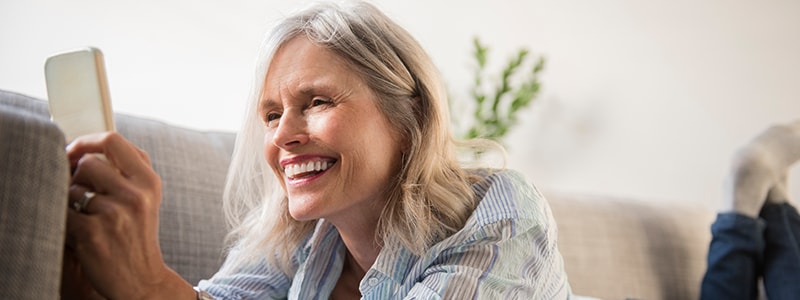 main woman smartphone couch