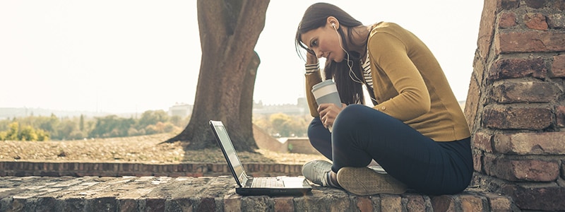 woman-laptop-headphone-coffe-cup