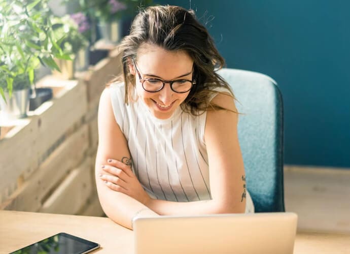 Woman looking out at her devives that are enabled with identify theft protection