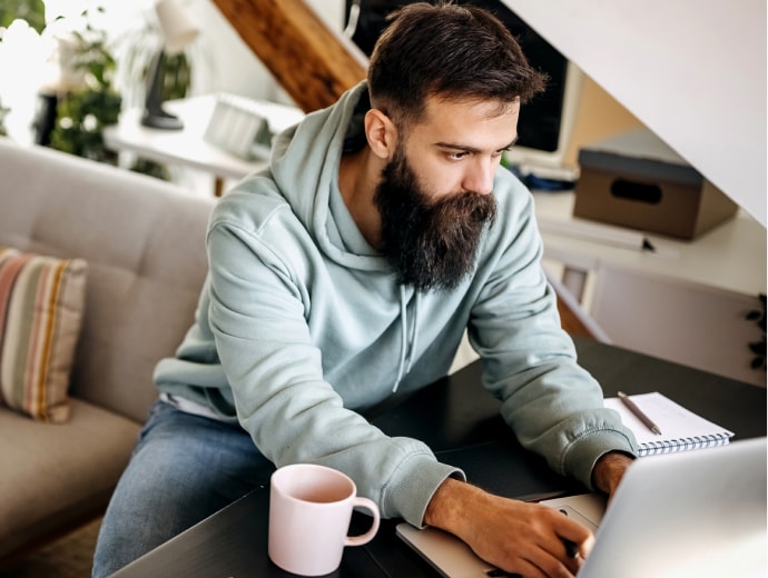 Young man working from home.