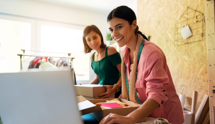 Two women looing at Laptop.